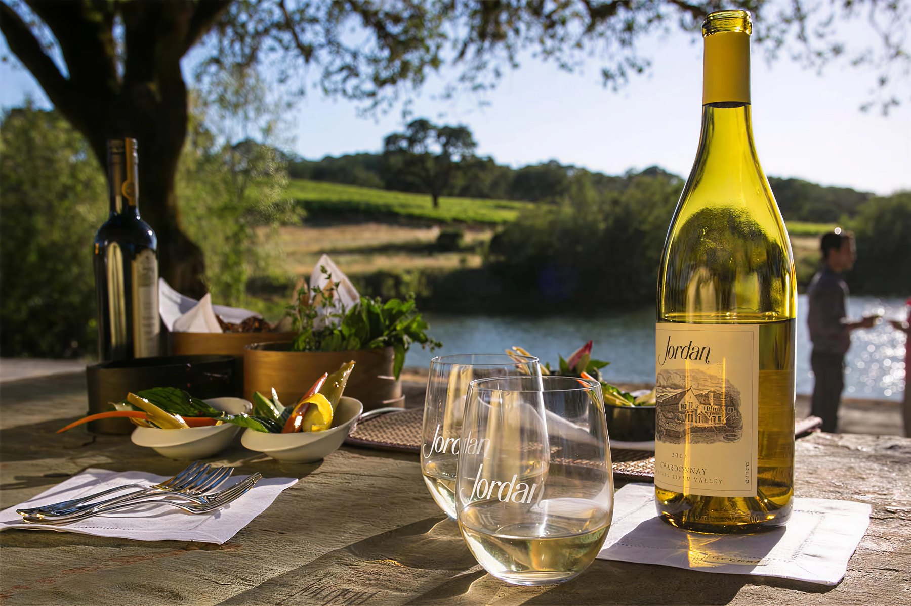 Jordan Chardonnay and branded glasses at golden hour, Jordan Wine Estate